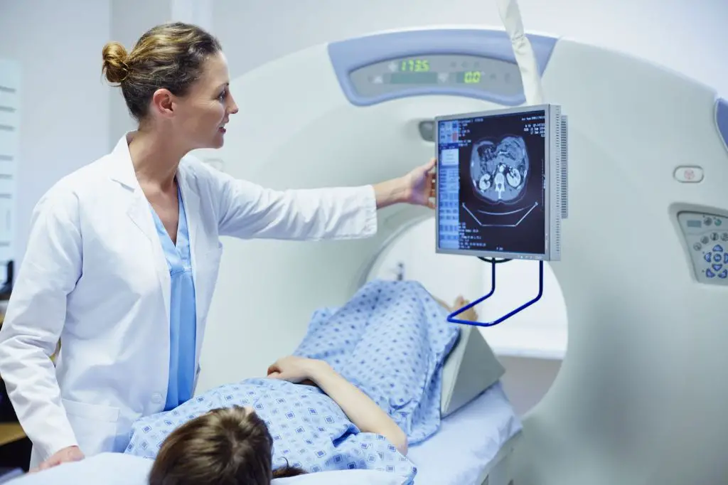 a doctor reviewing ct scan results