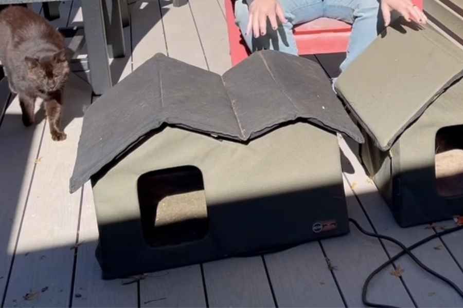 a heated outdoor cat shelter plugged into an outlet