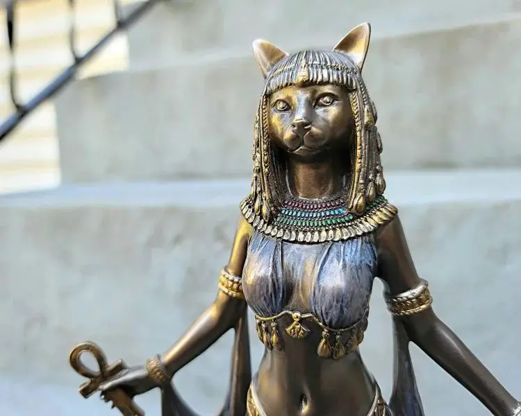 an ancient egyptian cat statue representing the cat goddess bastet