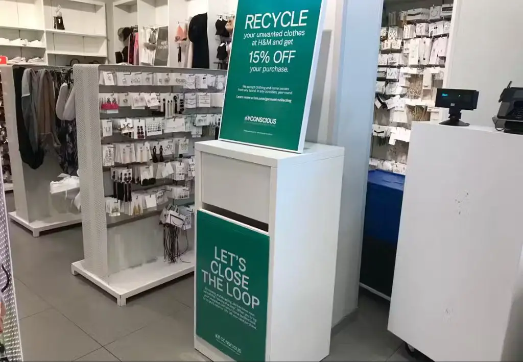 bins for recycling old clothing and shoes at a target store drop-off.