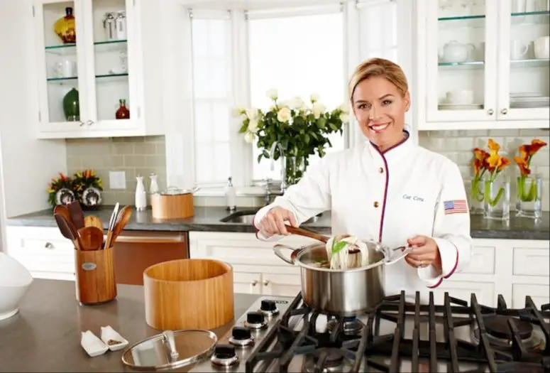 cat cora cooking in the kitchen at her first restaurant